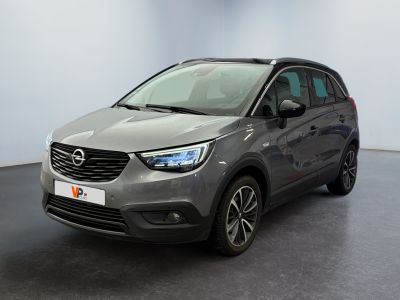 the grey opel suv is parked in a large room