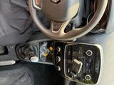 dashboard of a car with a steering wheel and dashboard controls