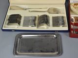 a tray with silverware in it and a tray with forks and spoons