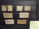 a piece of paper taped to a drawer with stamps on it