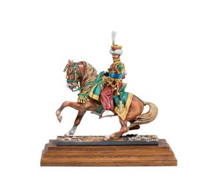 figurine of a man on a horse with a hat on his head