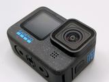 an action camera sitting on top of a table with a white background