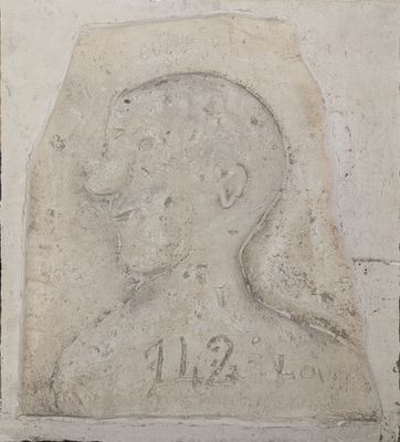a picture of a stone plaque with a picture of a man
