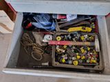 a chest full of assorted tools sitting on the floor