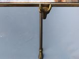 a dog that is sitting on a table with a mirror on it