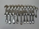 a lot of forks and spoons sitting on a table