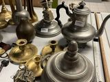 a lot of antique items on a table in a store