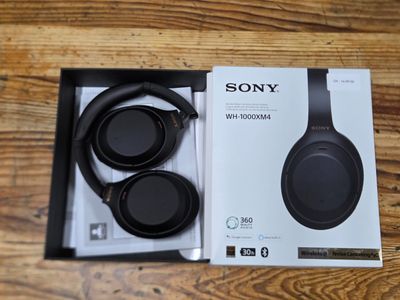the sony headphones are in the box on the table