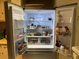 an image of an open refrigerator in a kitchen