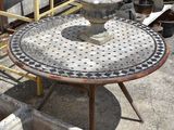 a table that is sitting on top of a cement slab