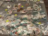 a table covered with lots of stamps and postcards