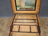 an old wooden box with a mirror inside of it on a wooden floor