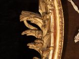 a gold frame with a picture of a ballerina on it