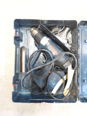 a blue tool box with tools in it on a table