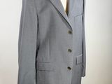 an image of a suit on a mannequin stand