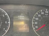 a close up of a car dashboard with various gauges and numbers
