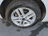 a close up of a tire on a car ' s rim