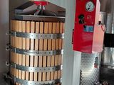an image of a machine that is making wine in a winery