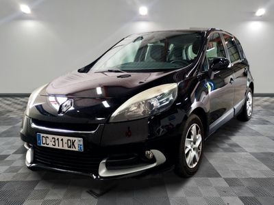 a picture of a small black car parked in a garage