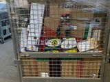 a large metal cage with a bunch of items inside of it