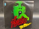 a close up of a box with a green face on it