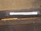 a piece of paper taped to a piece of wood
