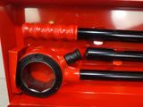 a red tool box with tools inside of it