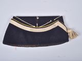 an old purse with a tassel hanging from it ' s side