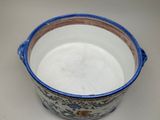 a blue and white bowl sitting on a table