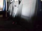 four seats in the back of a van that are empty