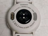 a close up of a watch on a white surface