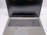 a laptop computer sitting on top of a white table