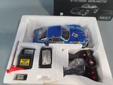 a toy car in a box with a remote control