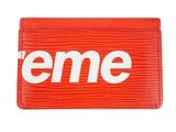 a red card case with the word eme on it