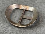 a metal buckle that has a metal buckle on it