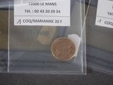 two bags with a coin in them on a table