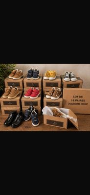 many boxes of shoes that are on a table