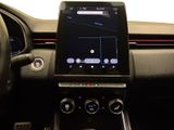 the dashboard of a car with a touch screen and steering controls