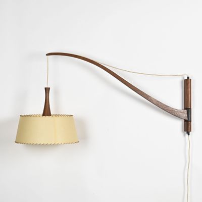 an image of a wall mounted lamp on a wall next to a lamp shade