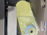 a cardboard box with a yellow skateboard inside of it