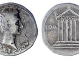a silver coin with a woman ' s face on it