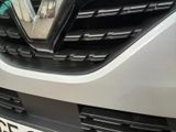 a close up of the front of a car with a badge on it