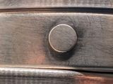 a close up of a metal drawer with a knob