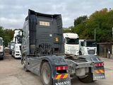 many trucks that are parked in a parking lot