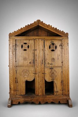 an old wooden cabinet with two doors and a door on one side