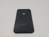 a close up of a black iphone sitting on top of a white table