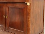 an image of a wooden sideboard with brass hardware