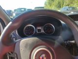dashboard view of a car with a steering wheel and gauges