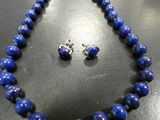 a necklace and earring set made of lapis