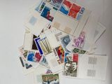 a pile of stamps on top of each other on a table